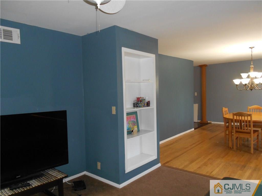 5 Kendall Road East Brunswick, NJ 08816 - Photo 3 of 12 a dining room with furniture and a flat screen tv