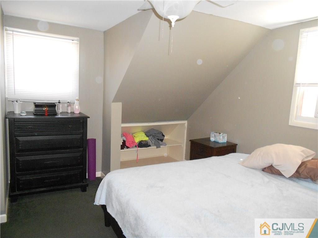 5 Kendall Road East Brunswick, NJ 08816 - Photo 7 of 12 a bedroom with a bed and window