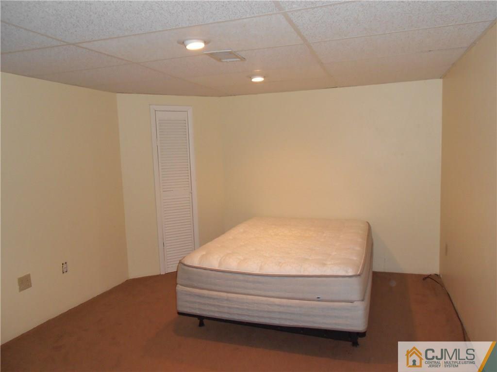 5 Kendall Road East Brunswick, NJ 08816 - Photo 9 of 12 a room with a bench