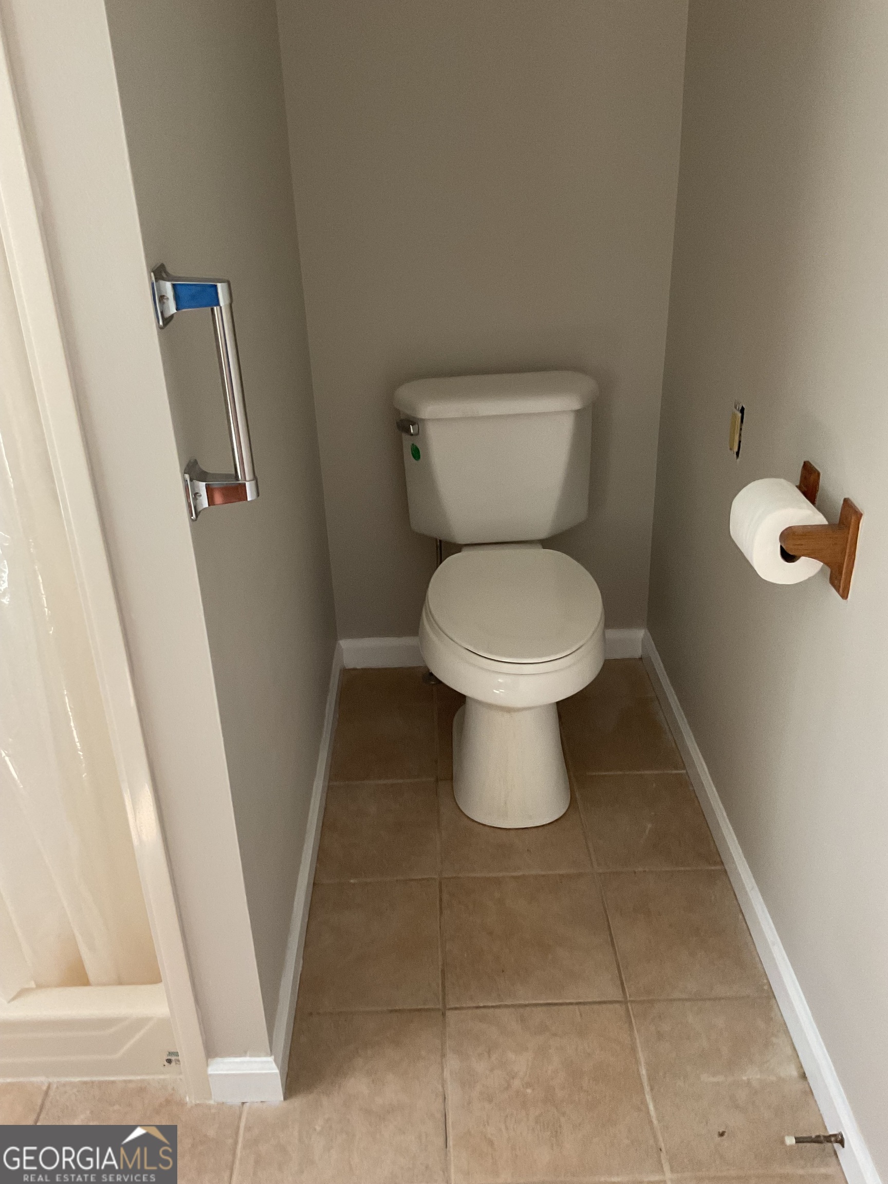 4800 Bethlehem Road Fairburn, GA 30213 - Photo 25 of 49 a bathroom with a toilet and a sink