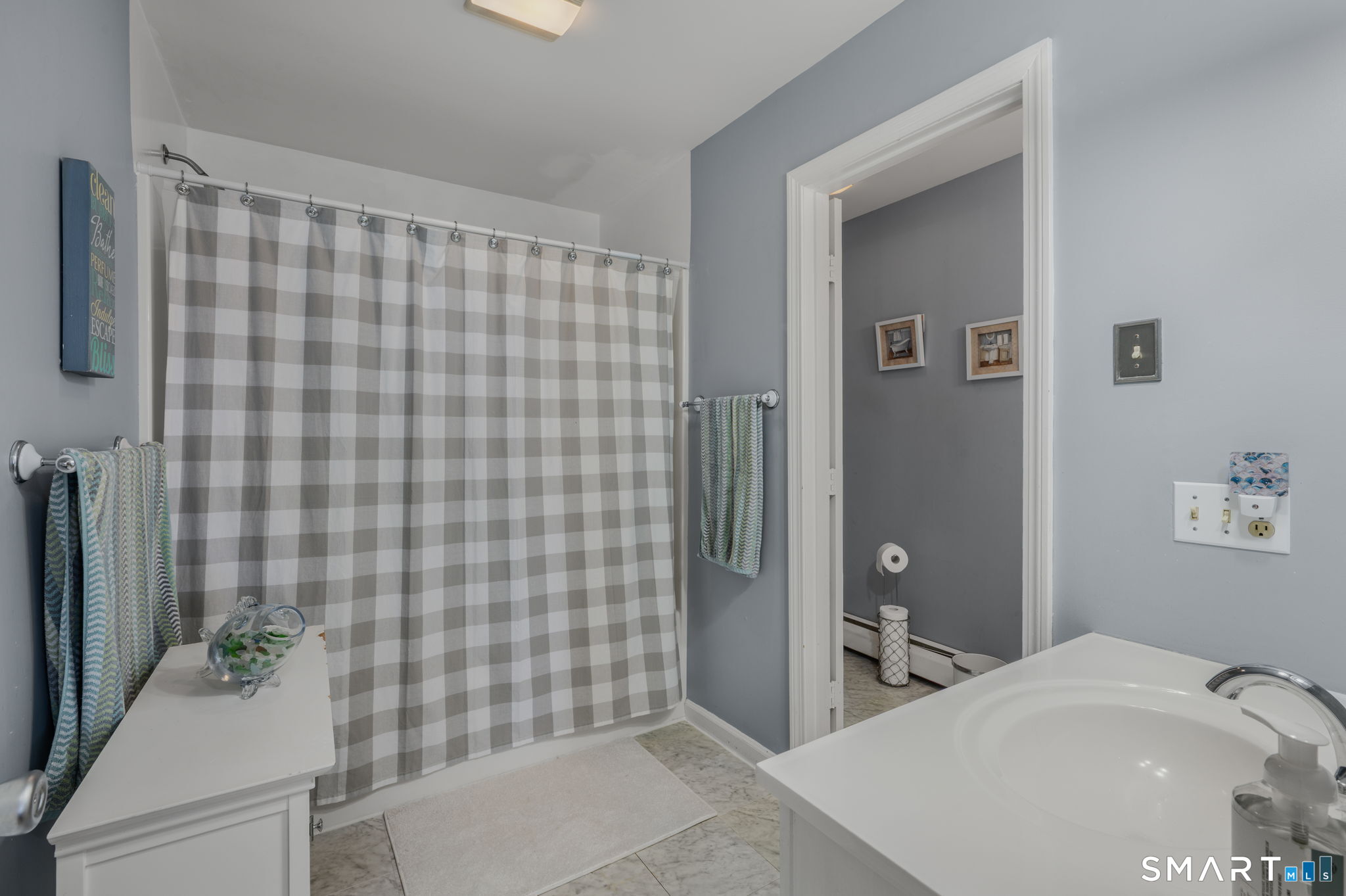 212 R Shore Road Waterford, CT 06385 - Photo 25 of 28 a bathroom with a sink and a mirror