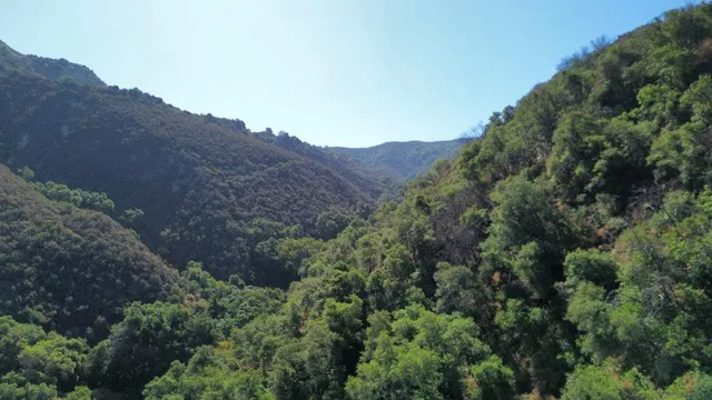 an aerial view of a house with mountain view