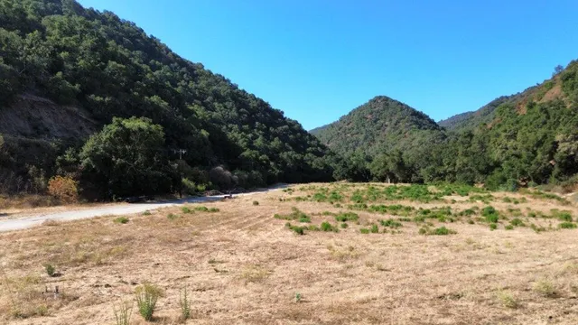 a view of snow on the side of a road