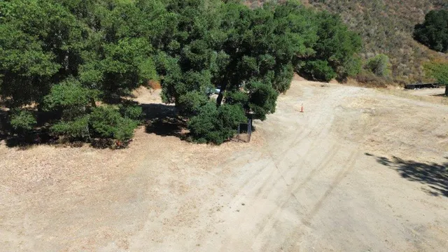 a view of a dry yard covered in snow