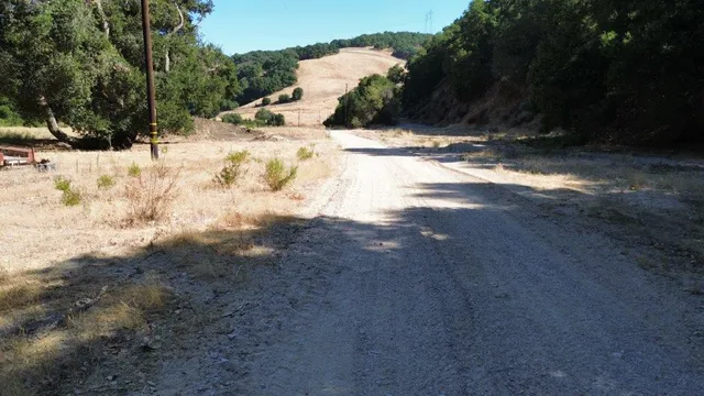 a view of a yard with a snow on the road