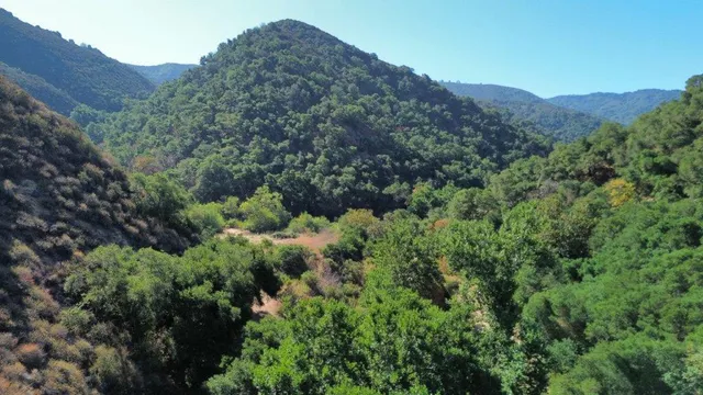 an aerial view of a house with mountain view