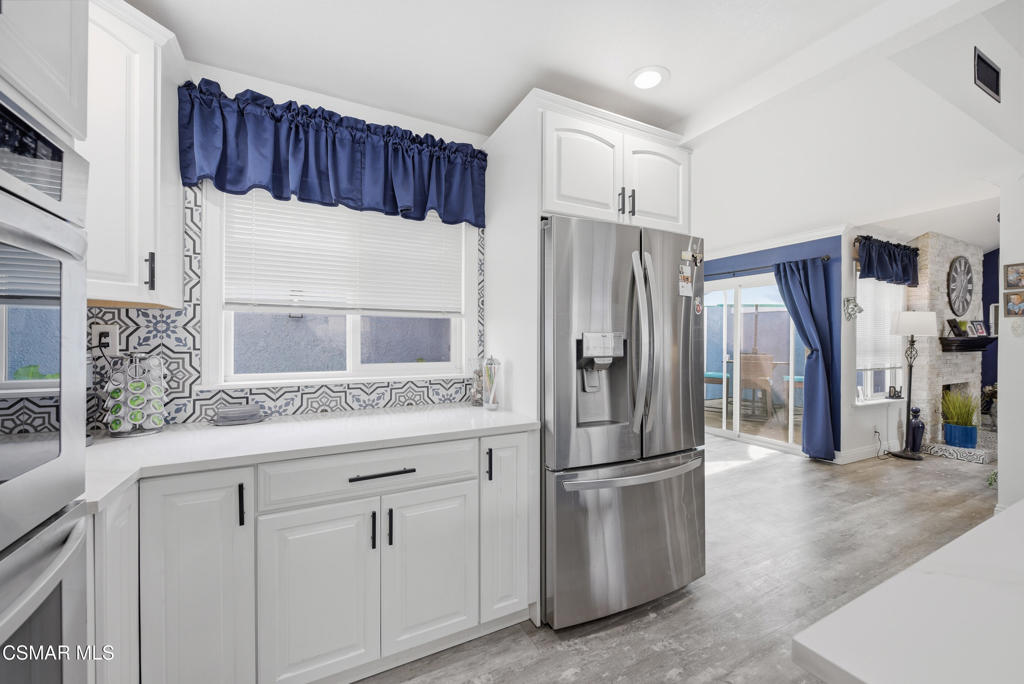 2497 Orangewood Place Simi Valley, CA 93065 - Photo 14 of 42 a kitchen with stainless steel appliances a refrigerator and a sink