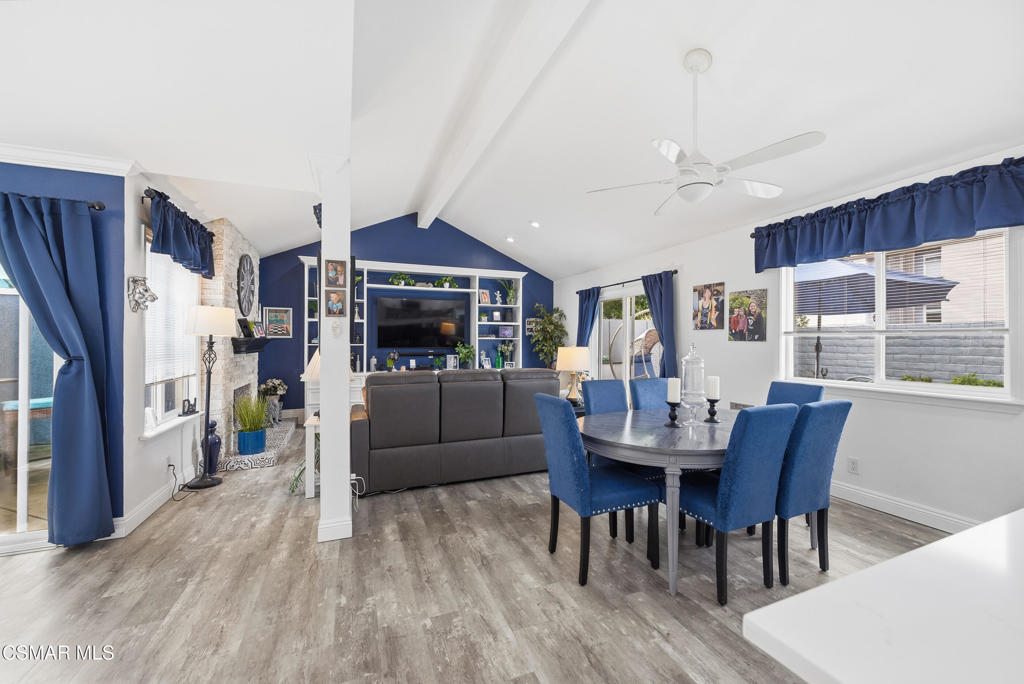 2497 Orangewood Place Simi Valley, CA 93065 - Photo 16 of 42 a living room with furniture a dining table and a refrigerator