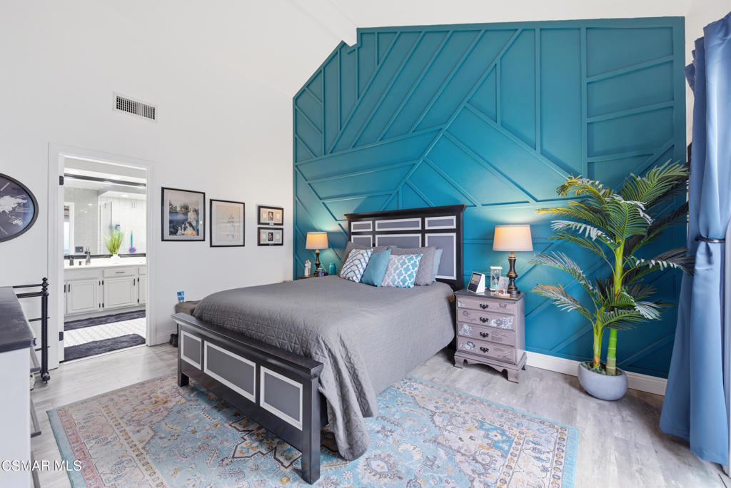 2497 Orangewood Place Simi Valley, CA 93065 - Photo 18 of 42 a bedroom with a bed table and a potted plant