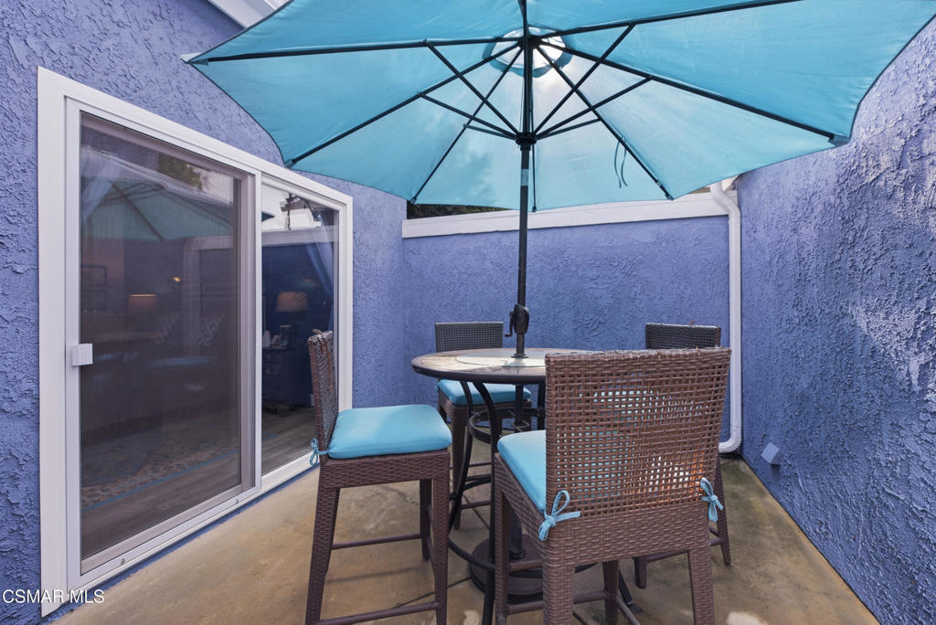 2497 Orangewood Place Simi Valley, CA 93065 - Photo 28 of 42 a patio with a table and chairs