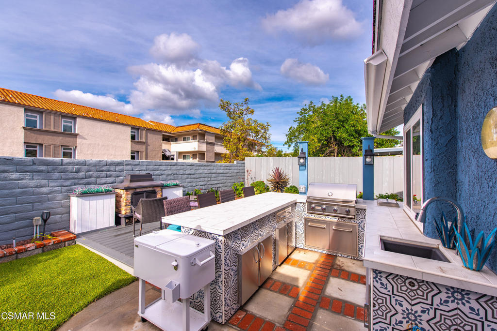 2497 Orangewood Place Simi Valley, CA 93065 - Photo 34 of 42 a view of a patio with couches chairs and a table and chairs