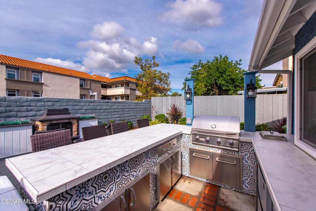2497 Orangewood Place Simi Valley, CA 93065 - Photo 37 of 42 a kitchen with a stove a sink and a kitchen