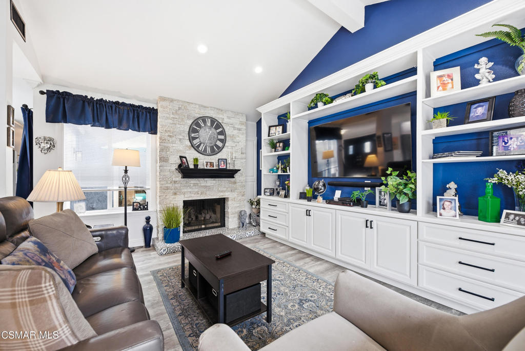 2497 Orangewood Place Simi Valley, CA 93065 - Photo 5 of 42 a living room with furniture a fireplace and a large window