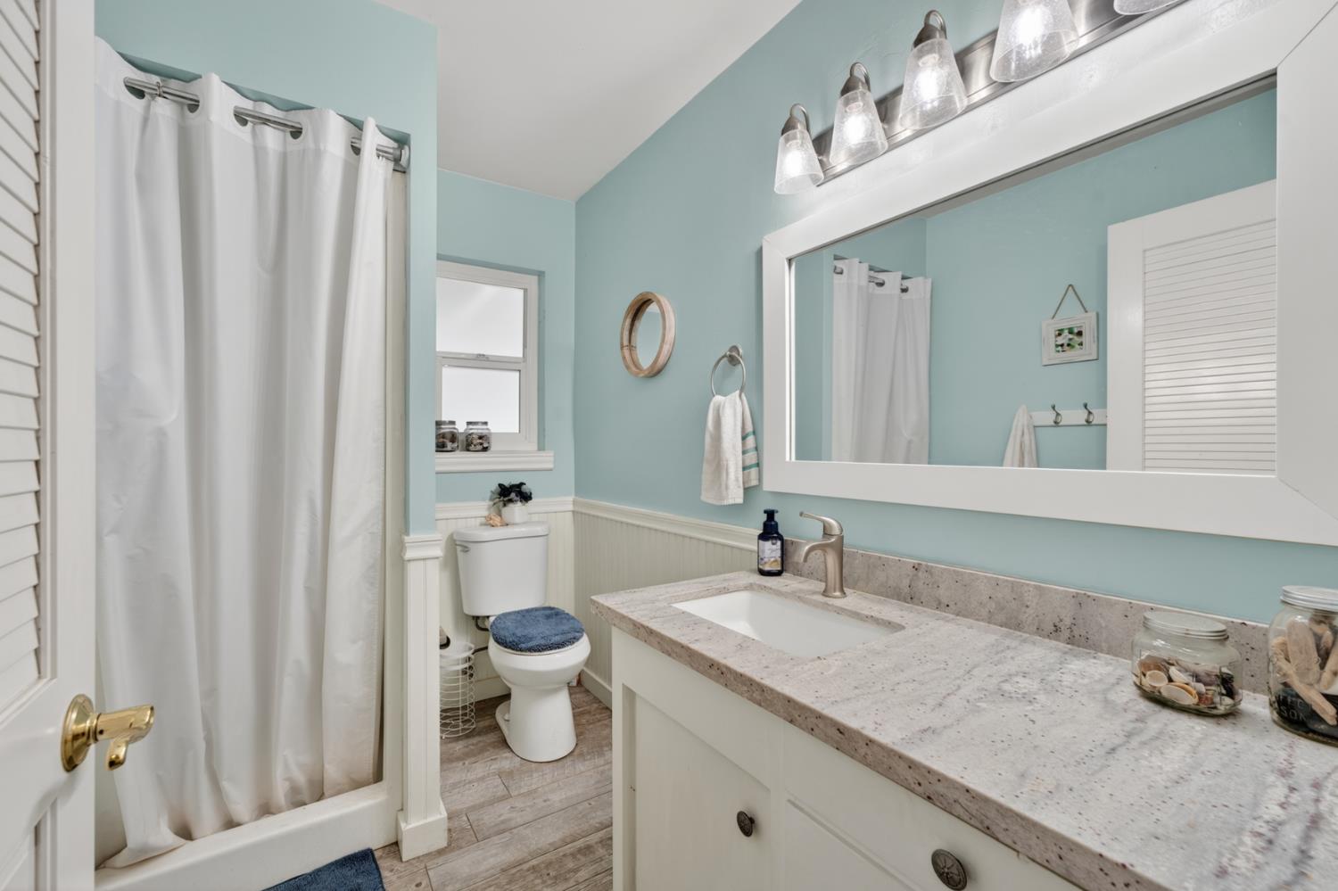 1880 Magnolia Street Gridley, CA 95948 - Photo 47 of 95 a bathroom with a granite countertop sink and a mirror