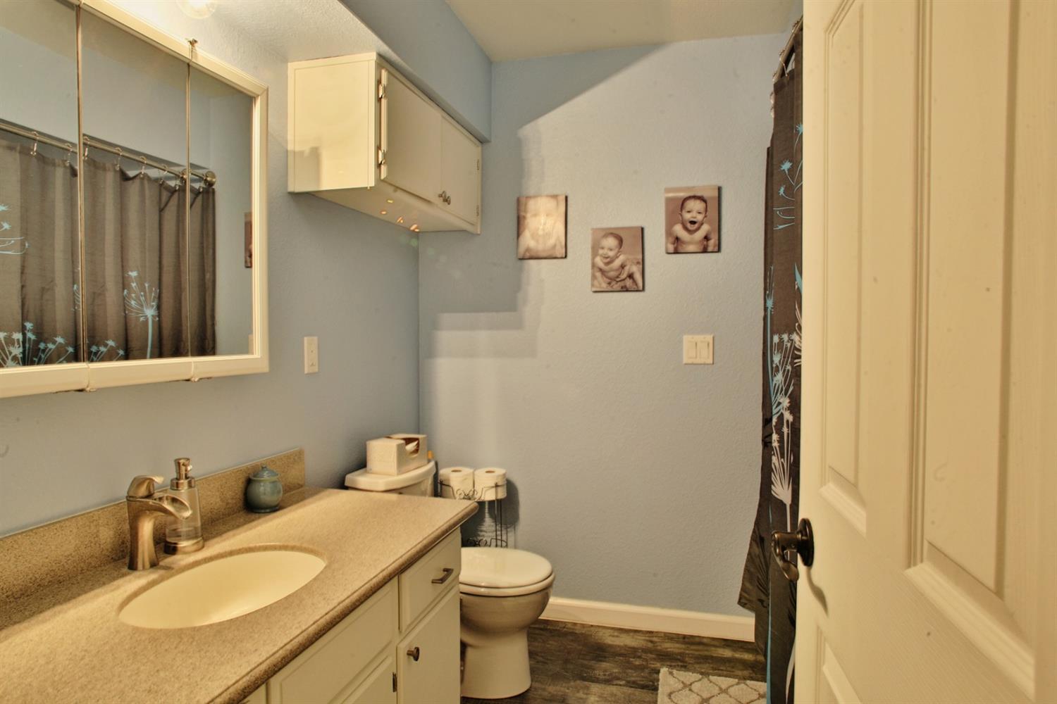 357 October Lane Merlin, OR 97532 - Photo 13 of 33 a bathroom with a granite countertop sink toilet and shower