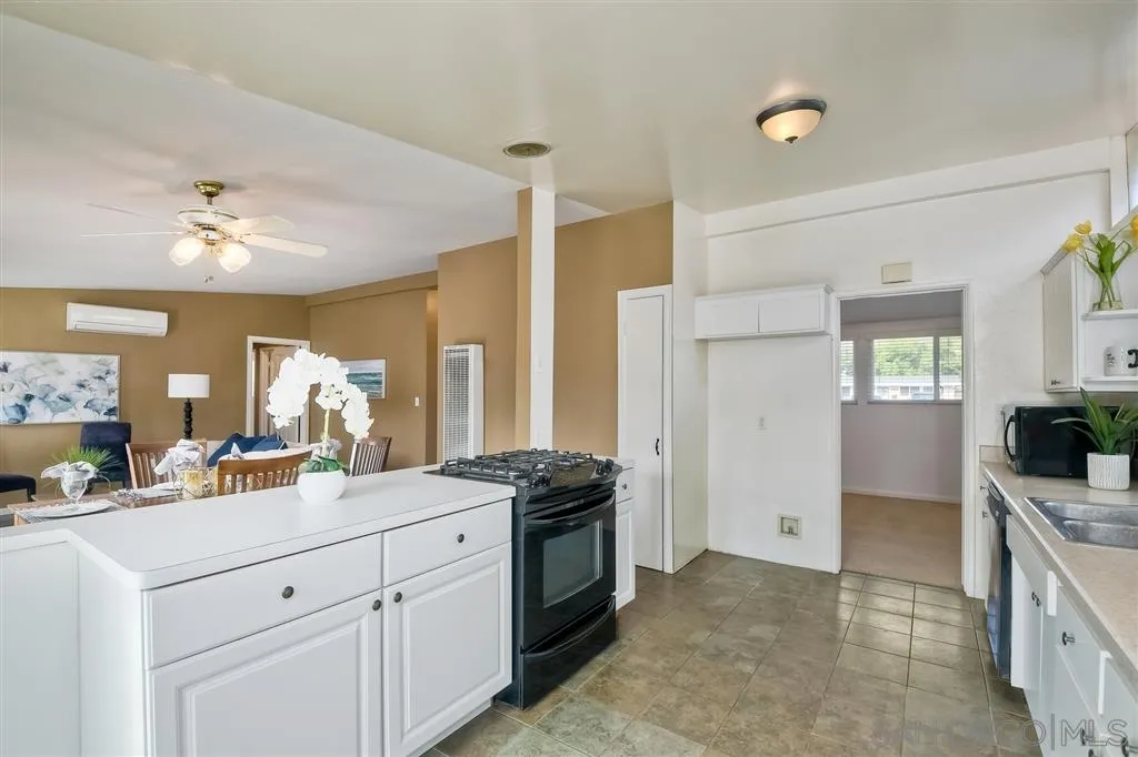 13733 Powers Road Poway, CA 92064 - Photo 11 of 23 a view of a kitchen counter space a sink and dishwasher