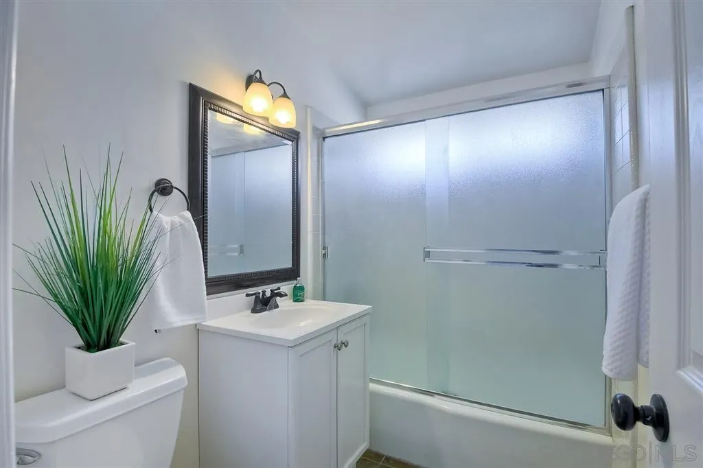 13733 Powers Road Poway, CA 92064 - Photo 17 of 23 a bathroom with a sink a toilet and shower