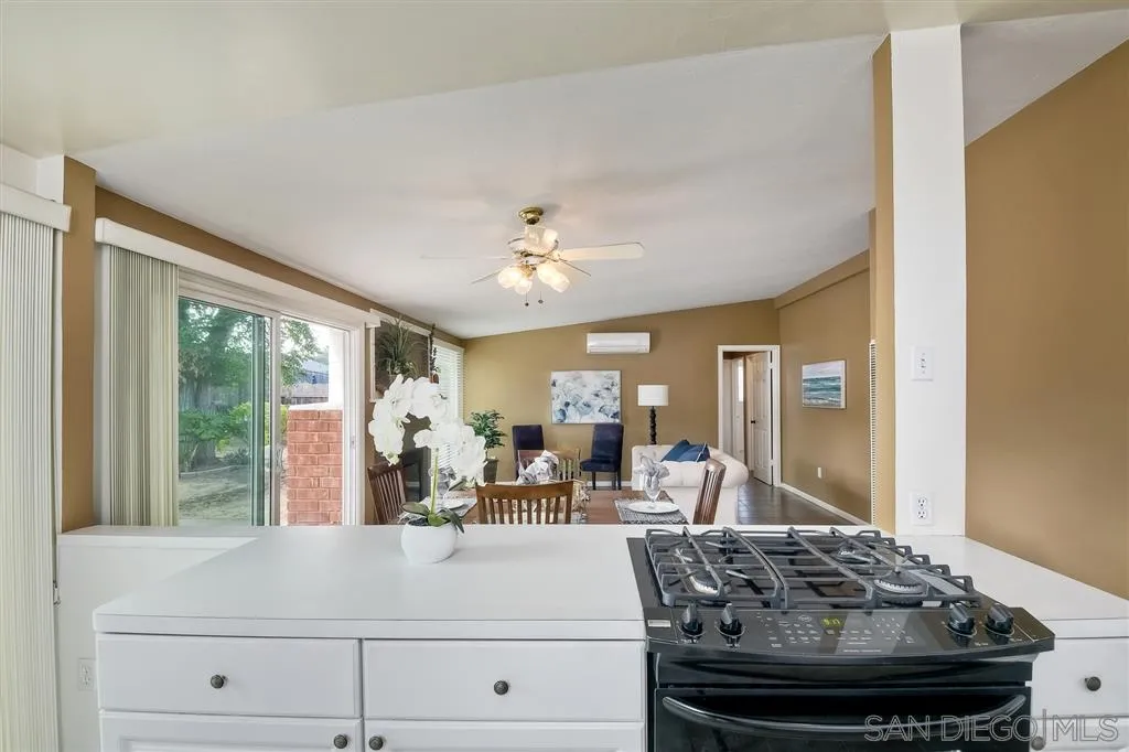13733 Powers Road Poway, CA 92064 - Photo 10 of 23 a view of a living room with furniture and large windows