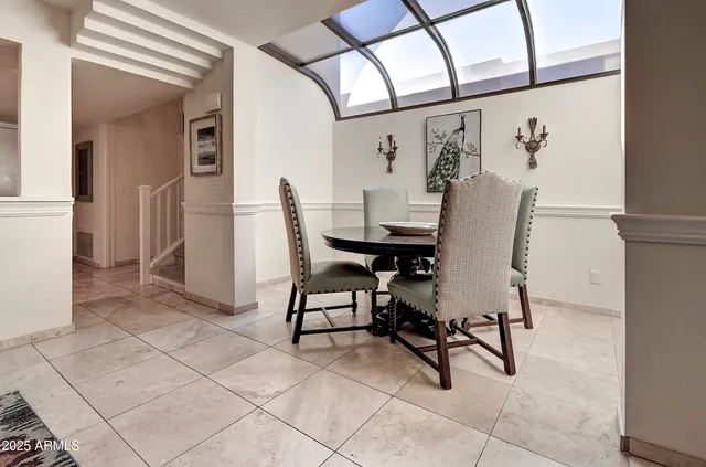 a kitchen with stainless steel appliances granite countertop a refrigerator and a stove