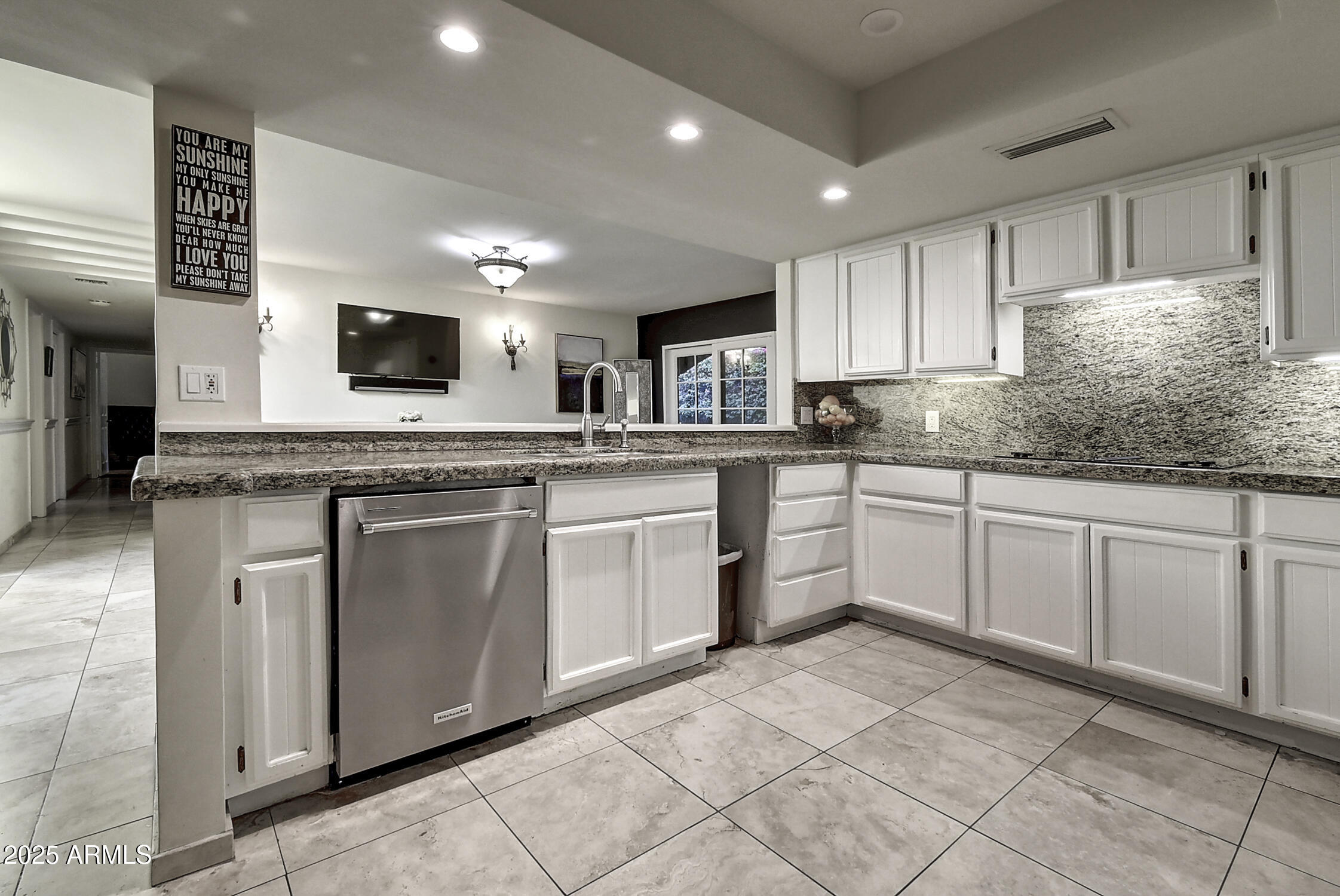 3050 East Marlette Avenue Phoenix, AZ 85016 - Photo 16 of 54 a kitchen with white cabinets stainless steel appliances and sink