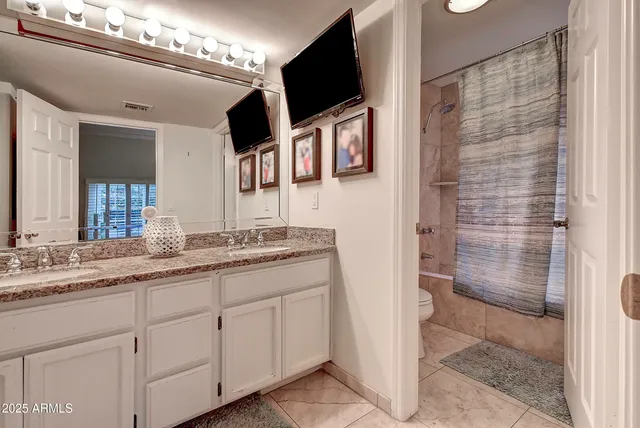 a bathroom with a shower and a toilet