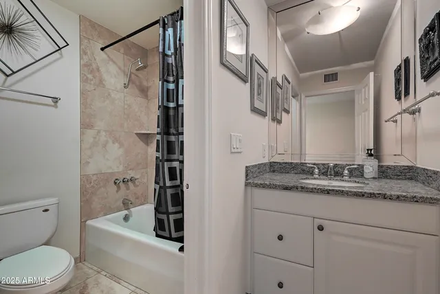 a bedroom with furniture and a flat screen tv