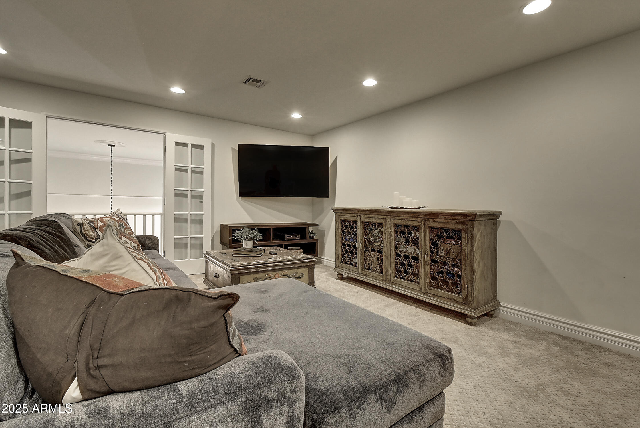 3050 East Marlette Avenue Phoenix, AZ 85016 - Photo 28 of 54 a living room with furniture and a flat screen tv