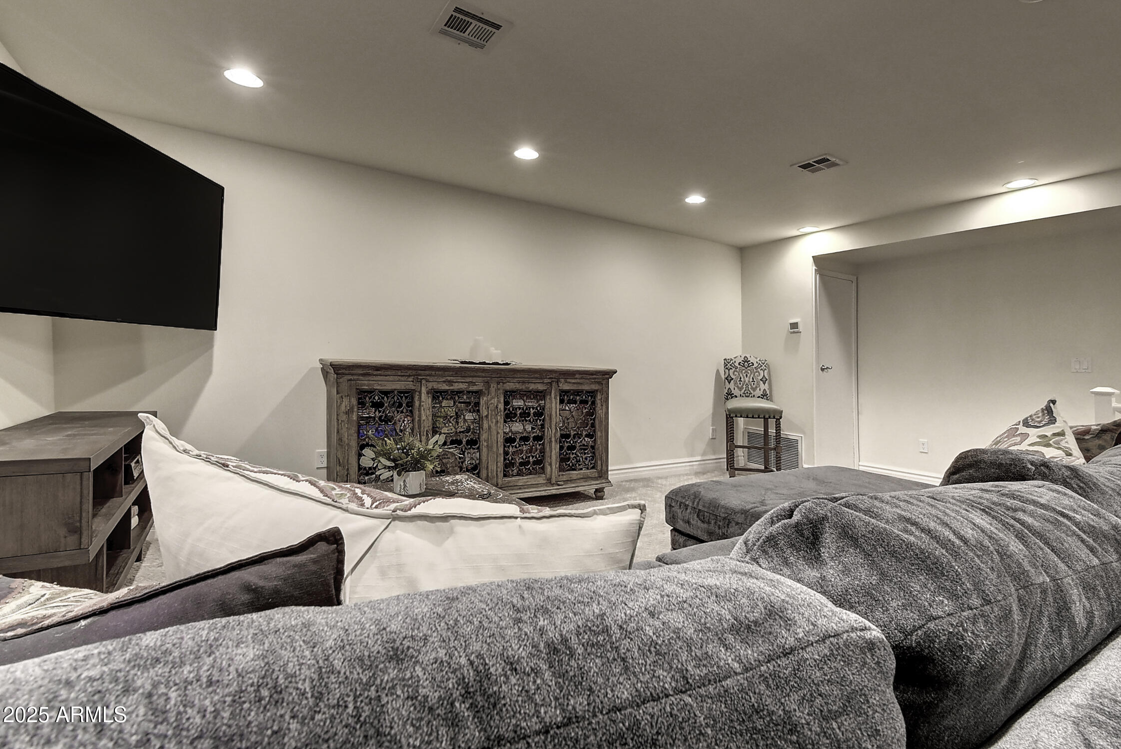 3050 East Marlette Avenue Phoenix, AZ 85016 - Photo 29 of 54 a large bedroom with a bed and a flat screen tv