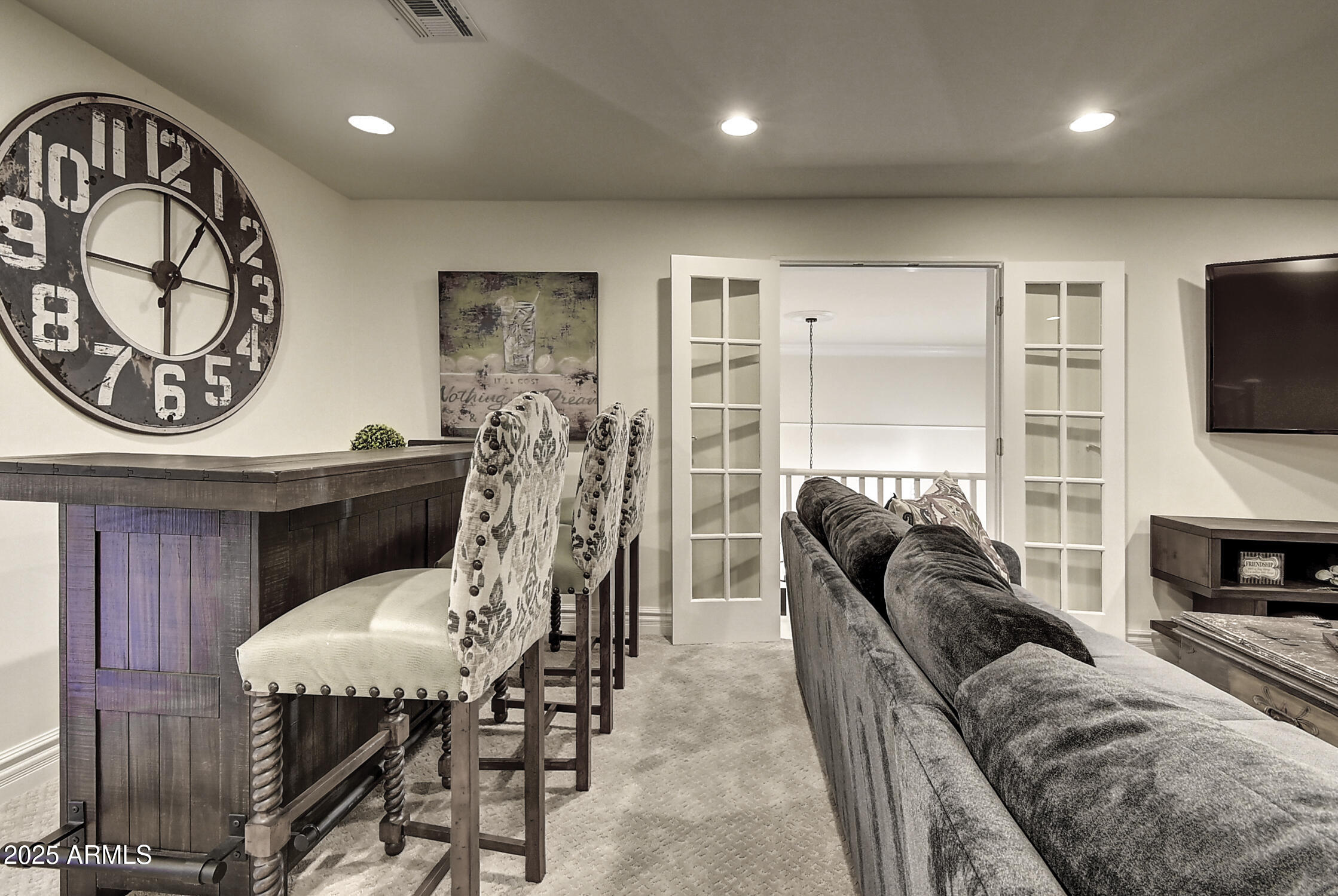 3050 East Marlette Avenue Phoenix, AZ 85016 - Photo 30 of 54 a living room with furniture a fireplace and a flat screen tv