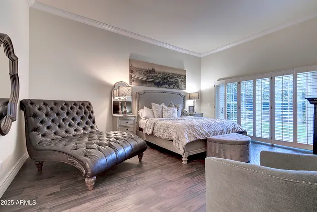 a bedroom with a bed and a couch