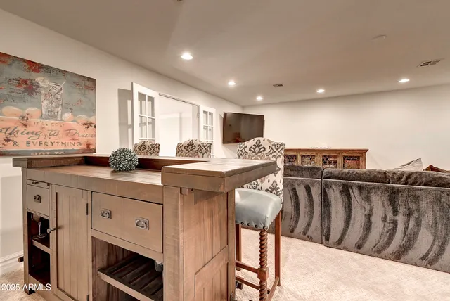 a view of a livingroom with furniture and window