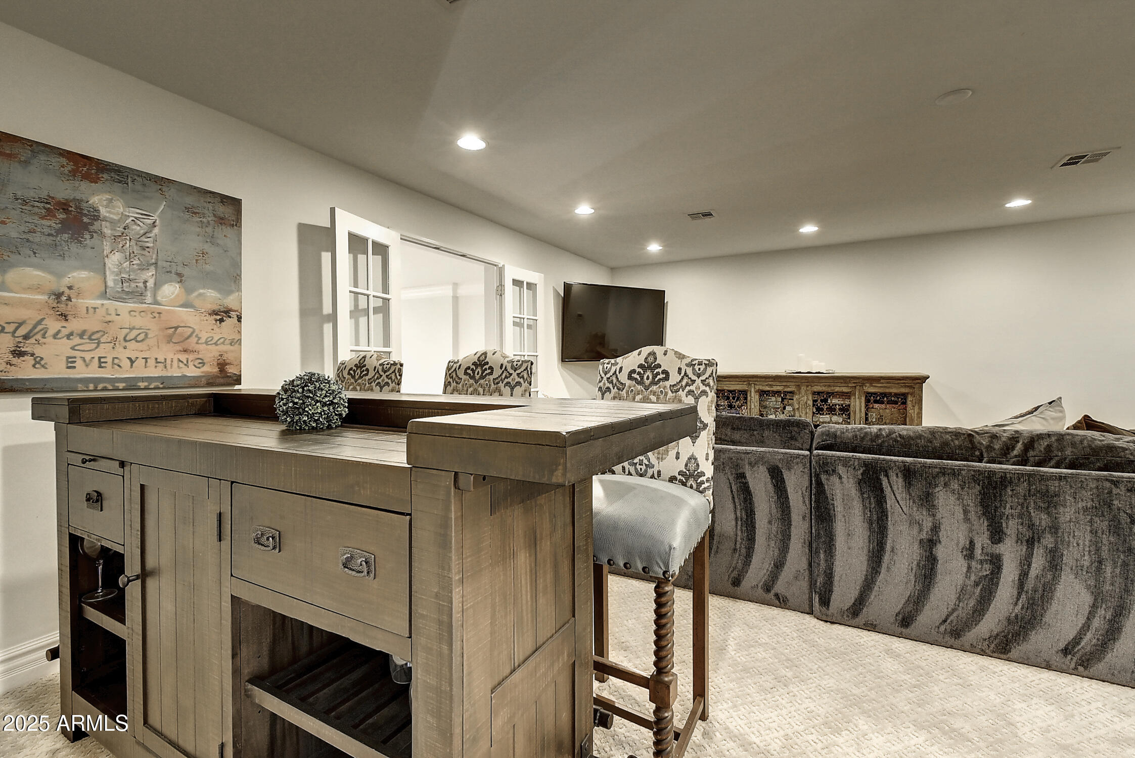 3050 East Marlette Avenue Phoenix, AZ 85016 - Photo 31 of 54 a kitchen with stainless steel appliances kitchen island granite countertop a sink and cabinets