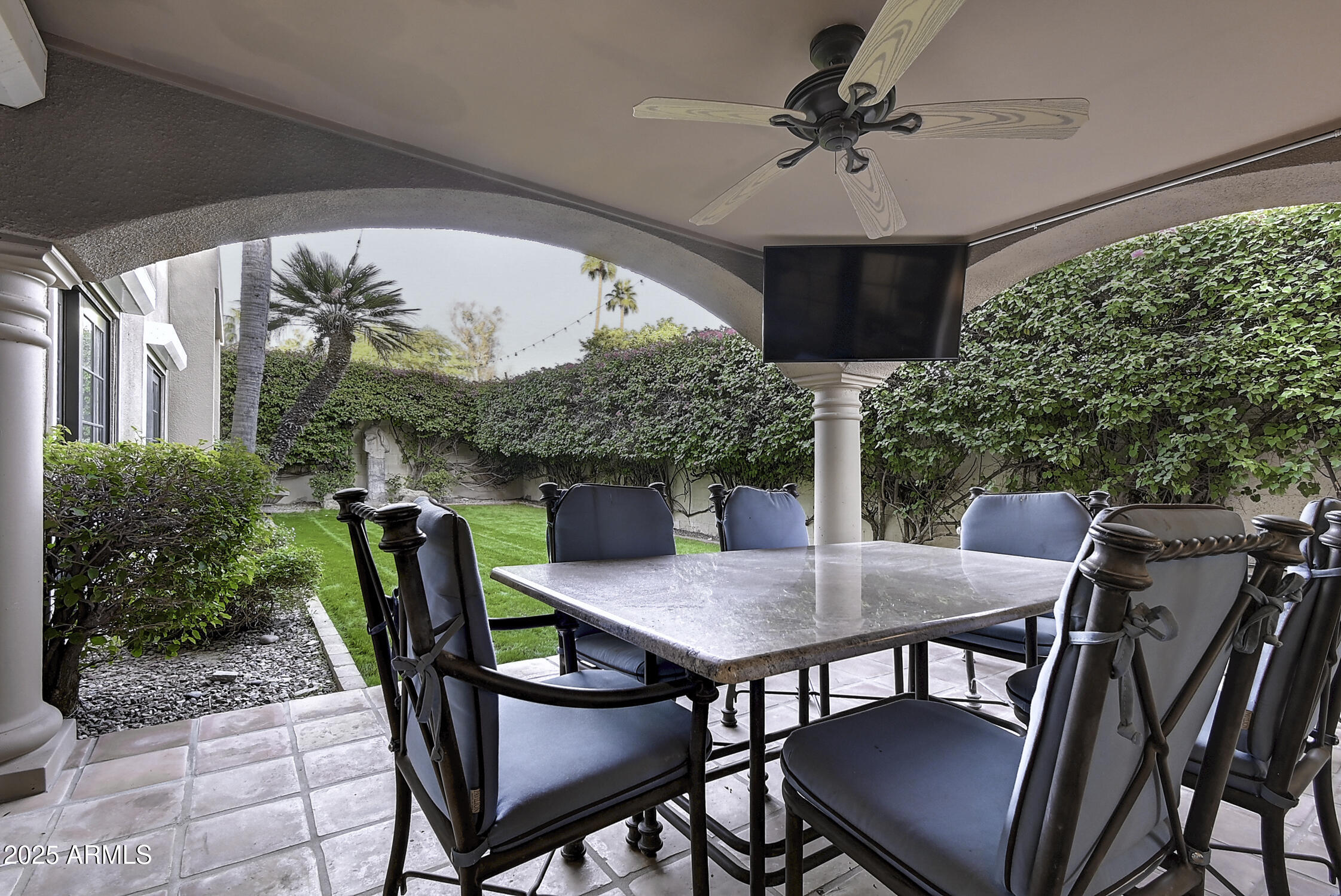 3050 East Marlette Avenue Phoenix, AZ 85016 - Photo 40 of 54 a view of a patio with a table and chairs