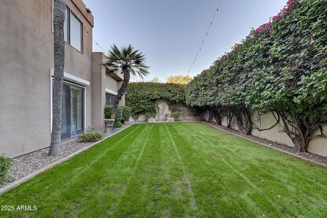 a backyard of a house with lots of green space
