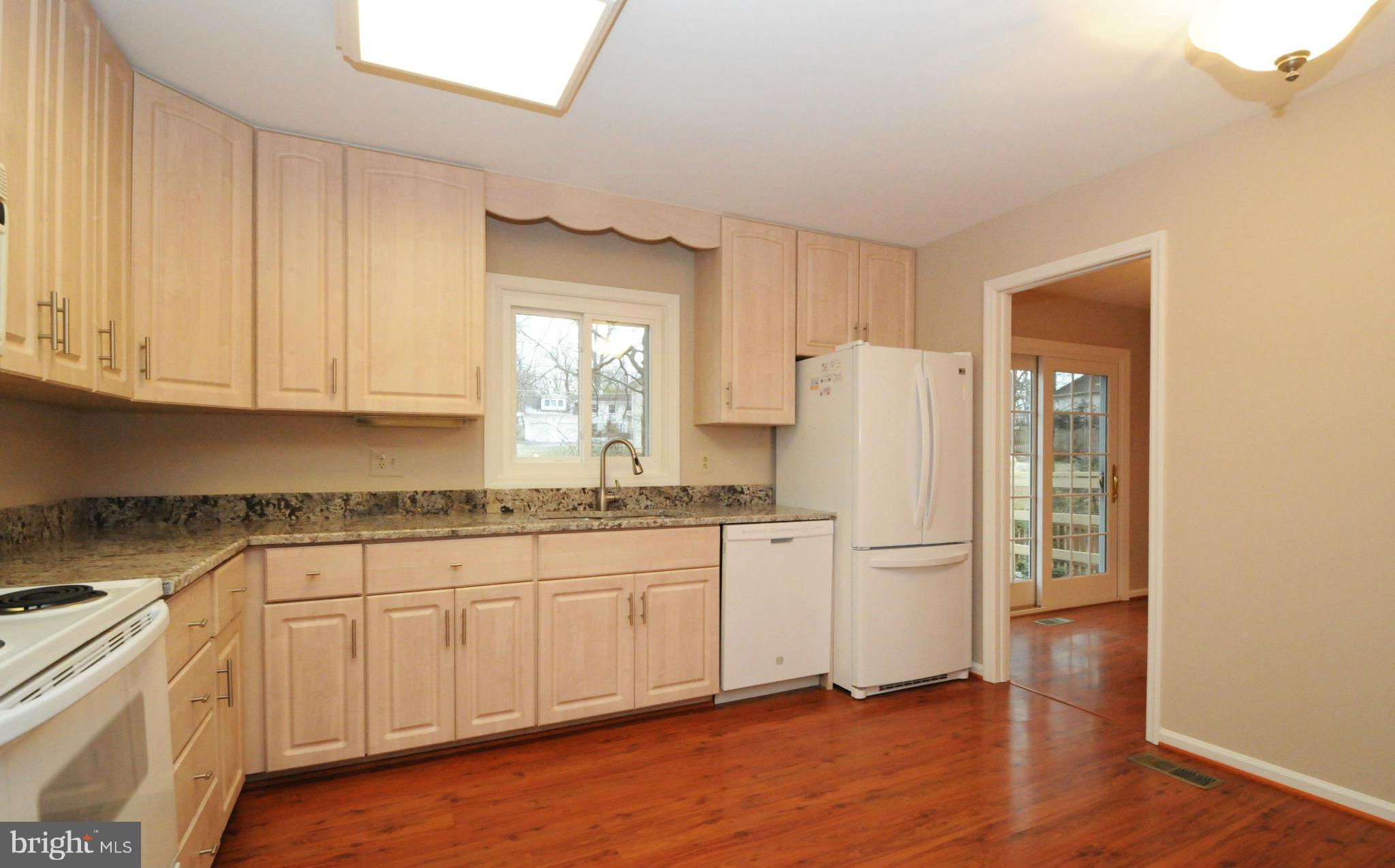 8425 Blevins Way Court Vienna, VA 22182 - Photo 13 of 30 a kitchen with stainless steel appliances granite countertop a refrigerator and a stove top oven
