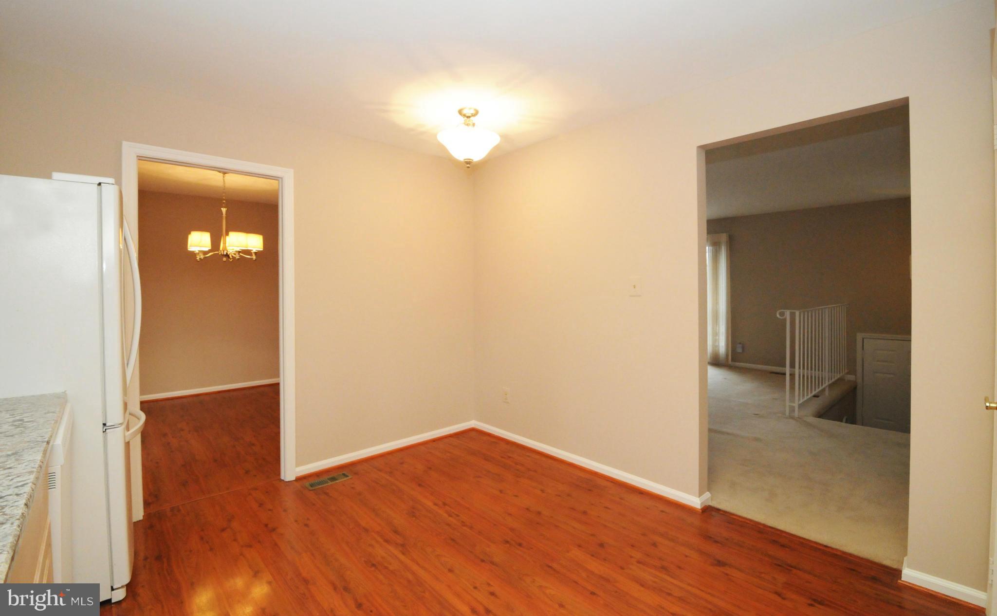 8425 Blevins Way Court Vienna, VA 22182 - Photo 16 of 30 wooden floor in an empty room