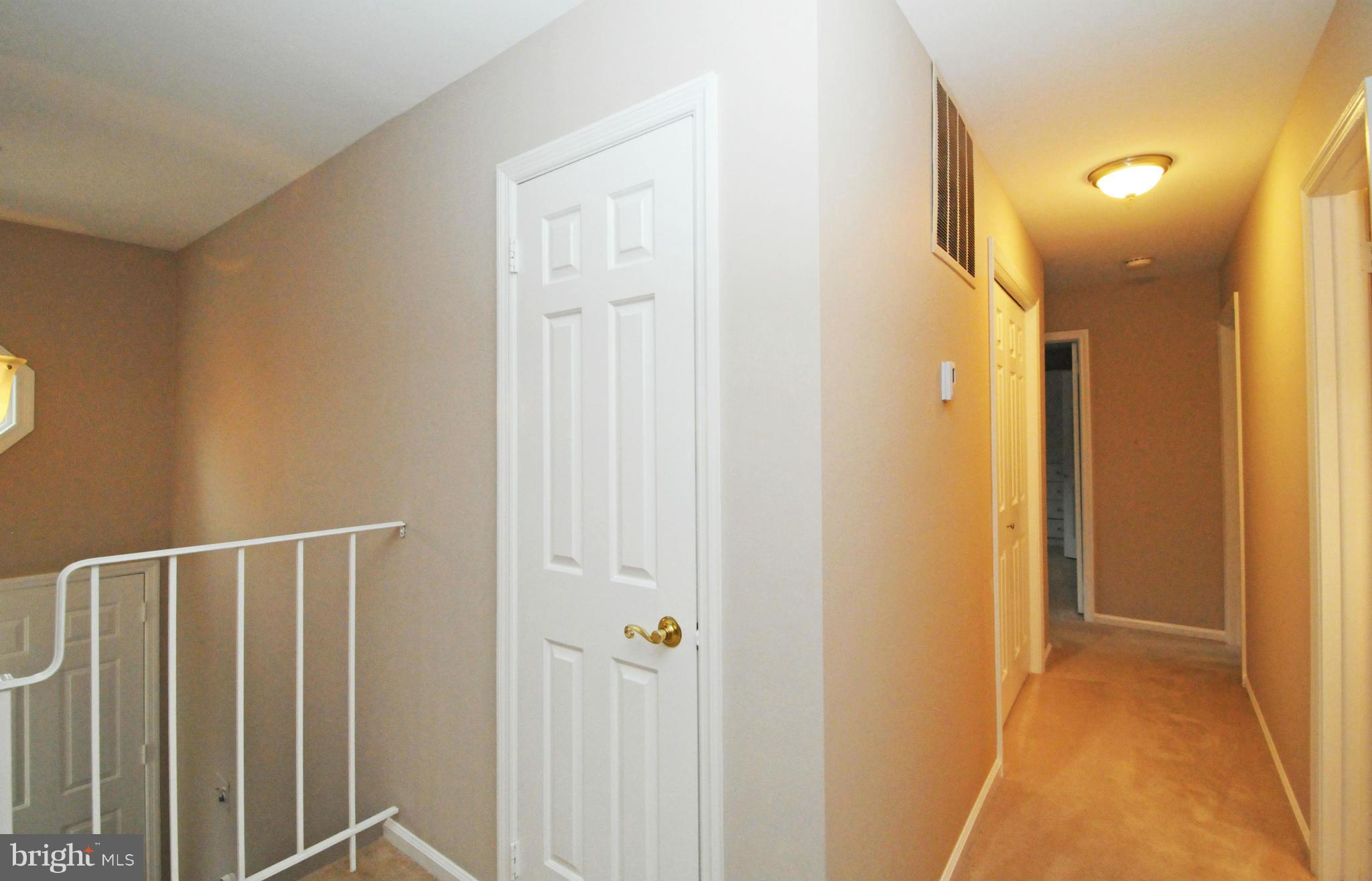 8425 Blevins Way Court Vienna, VA 22182 - Photo 17 of 30 a view of hallway with wooden floor