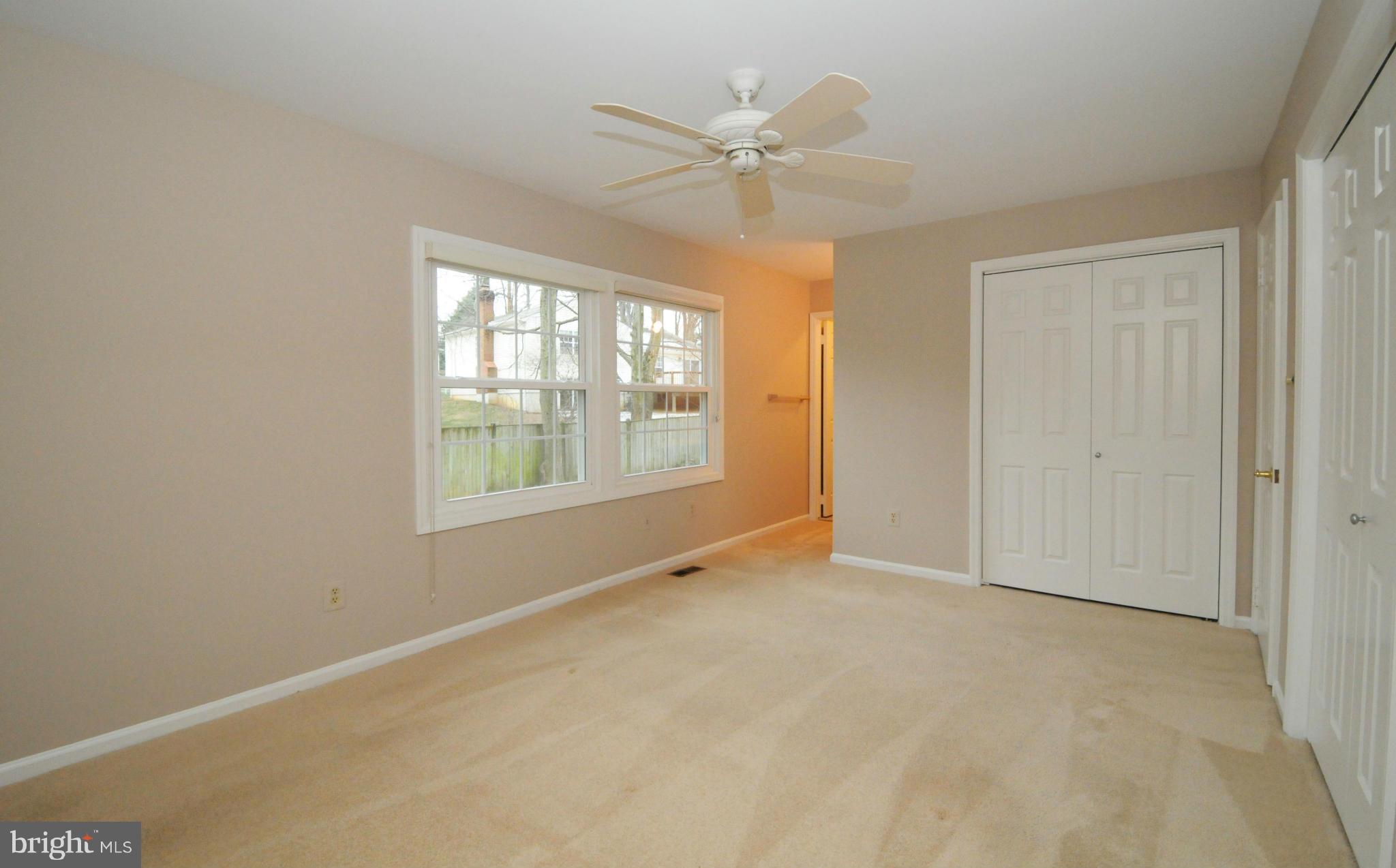 8425 Blevins Way Court Vienna, VA 22182 - Photo 19 of 30 an empty room with windows and fan