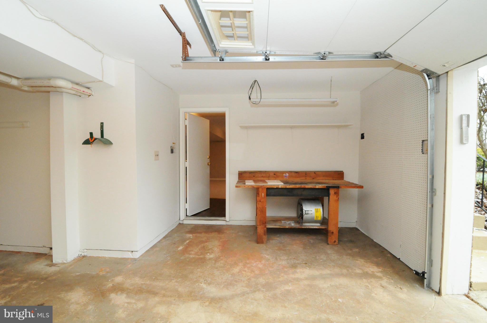 8425 Blevins Way Court Vienna, VA 22182 - Photo 30 of 30 a view of an empty room with a fireplace and a window