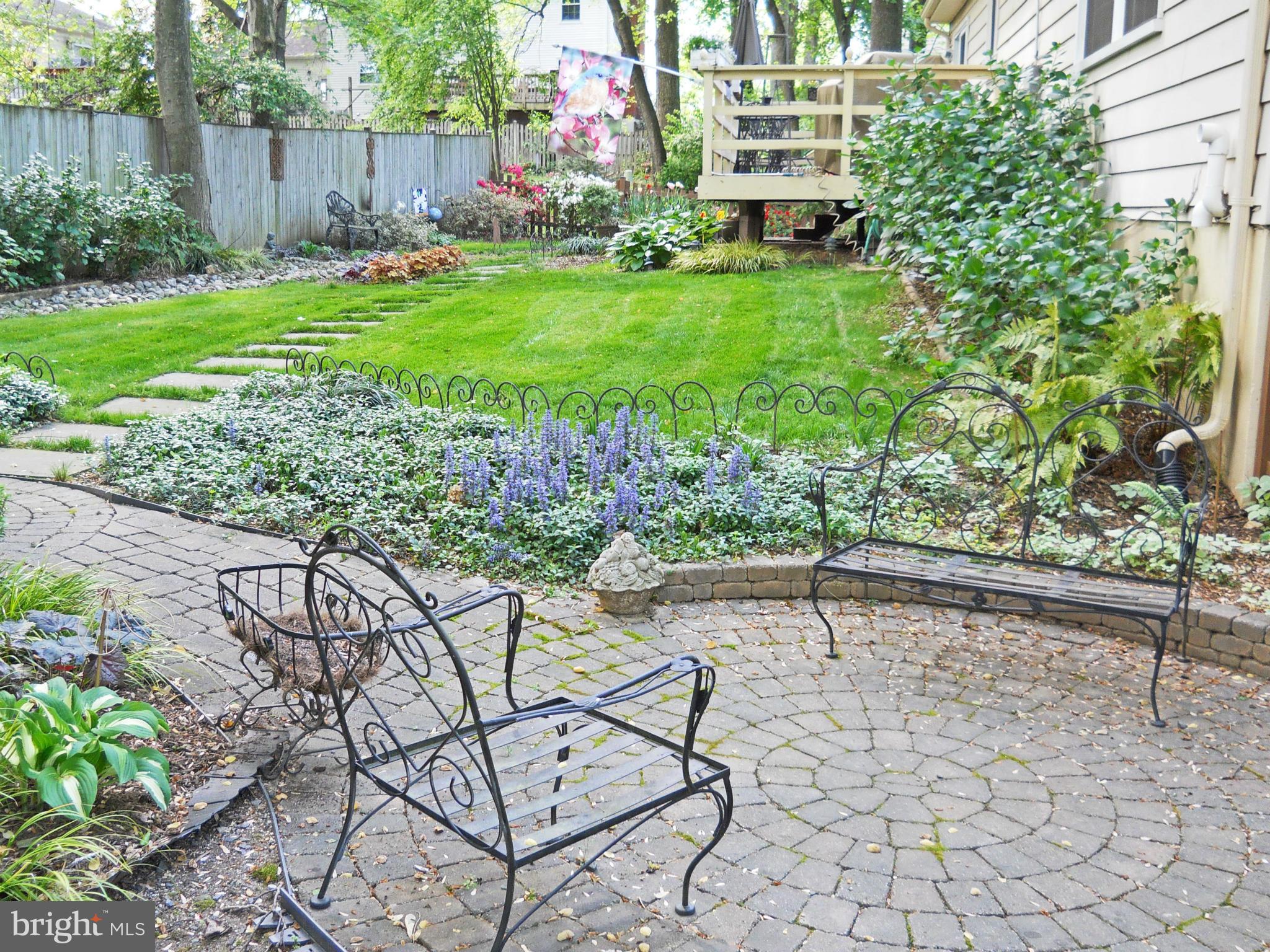 8425 Blevins Way Court Vienna, VA 22182 - Photo 8 of 30 a view of a chairs and bench in the garden