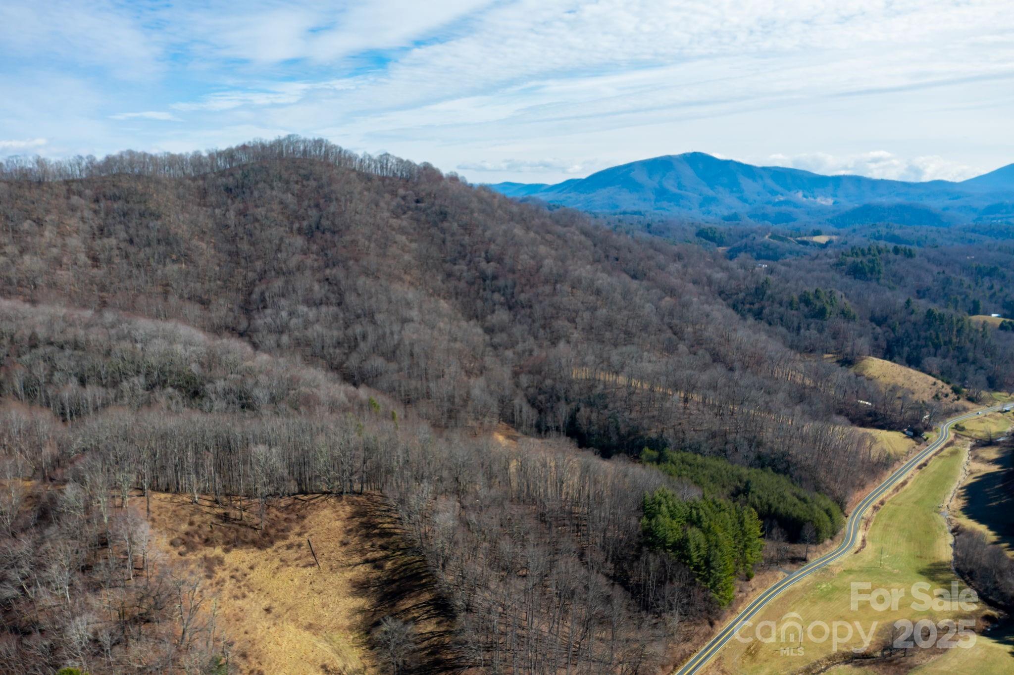 a view of a mountain with mountains in the background