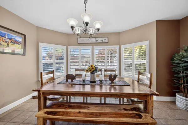 a view of a dining room with furniture window and outside view