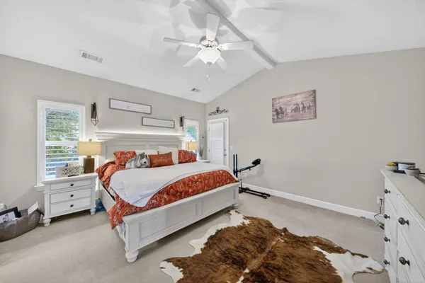 a bed room with a bed and a window