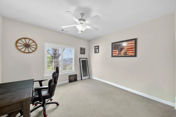 a view of a livingroom with furniture and a window