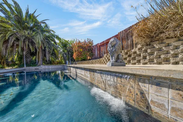 a view of swimming pool with seating area