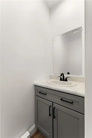 a view with a sink and cabinets