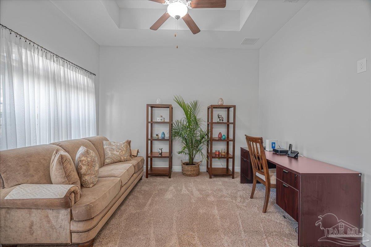 5997 Stonechase Boulevard Pace, FL 32571 - Photo 11 of 52 a living room with furniture and wooden floor