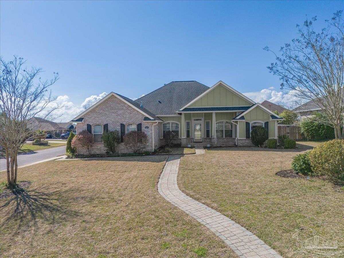 5997 Stonechase Boulevard Pace, FL 32571 - Photo 2 of 52 a front view of house with yard