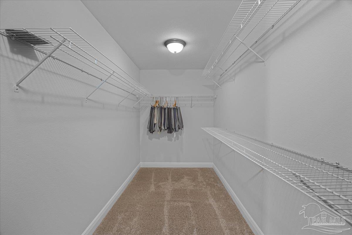 5997 Stonechase Boulevard Pace, FL 32571 - Photo 30 of 52 a view of a room with racks on the wall