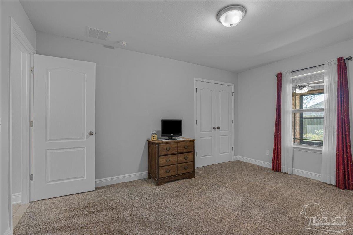 5997 Stonechase Boulevard Pace, FL 32571 - Photo 39 of 52 a view of a livingroom with a kitchen